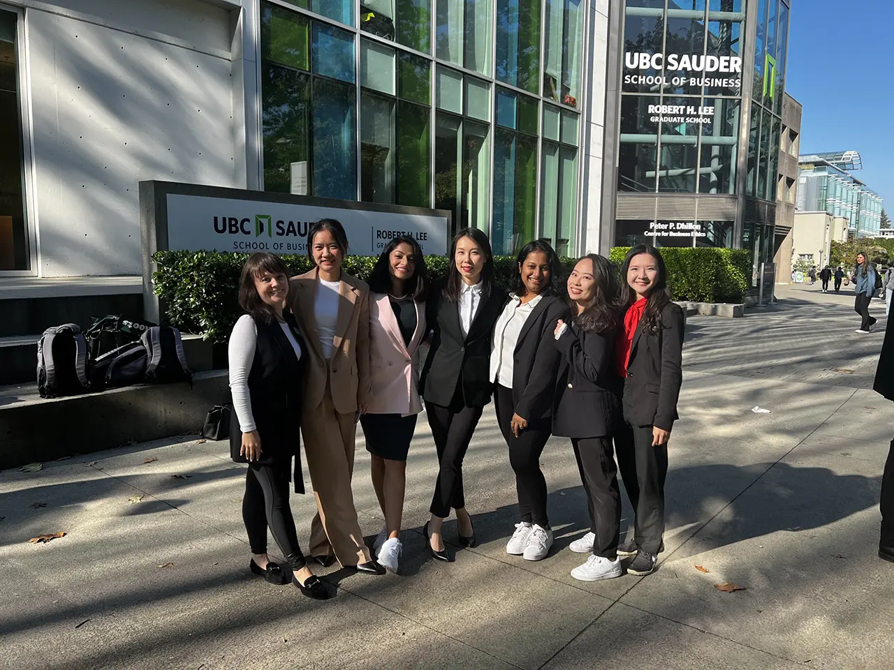 Students enjoy a sunny day with friends from her MBA cohort at UBC Sauder.