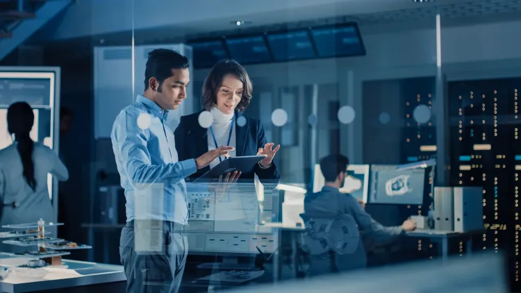 Two people looking over data