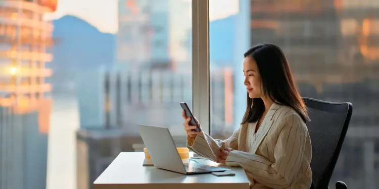 Women working on her laptop and phone