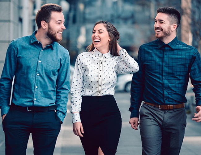 Image of three students walking together outside