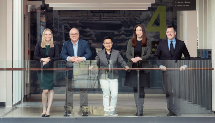 Dr. Jiaying Zhao (centre) and the Decision Insights for Business & Society (DIBS) Team. Photo credit: Sauder School of Business.