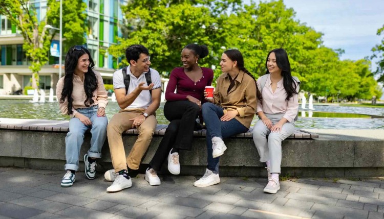 students by the fountain