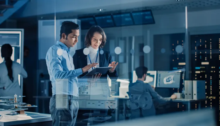 Two people looking over data